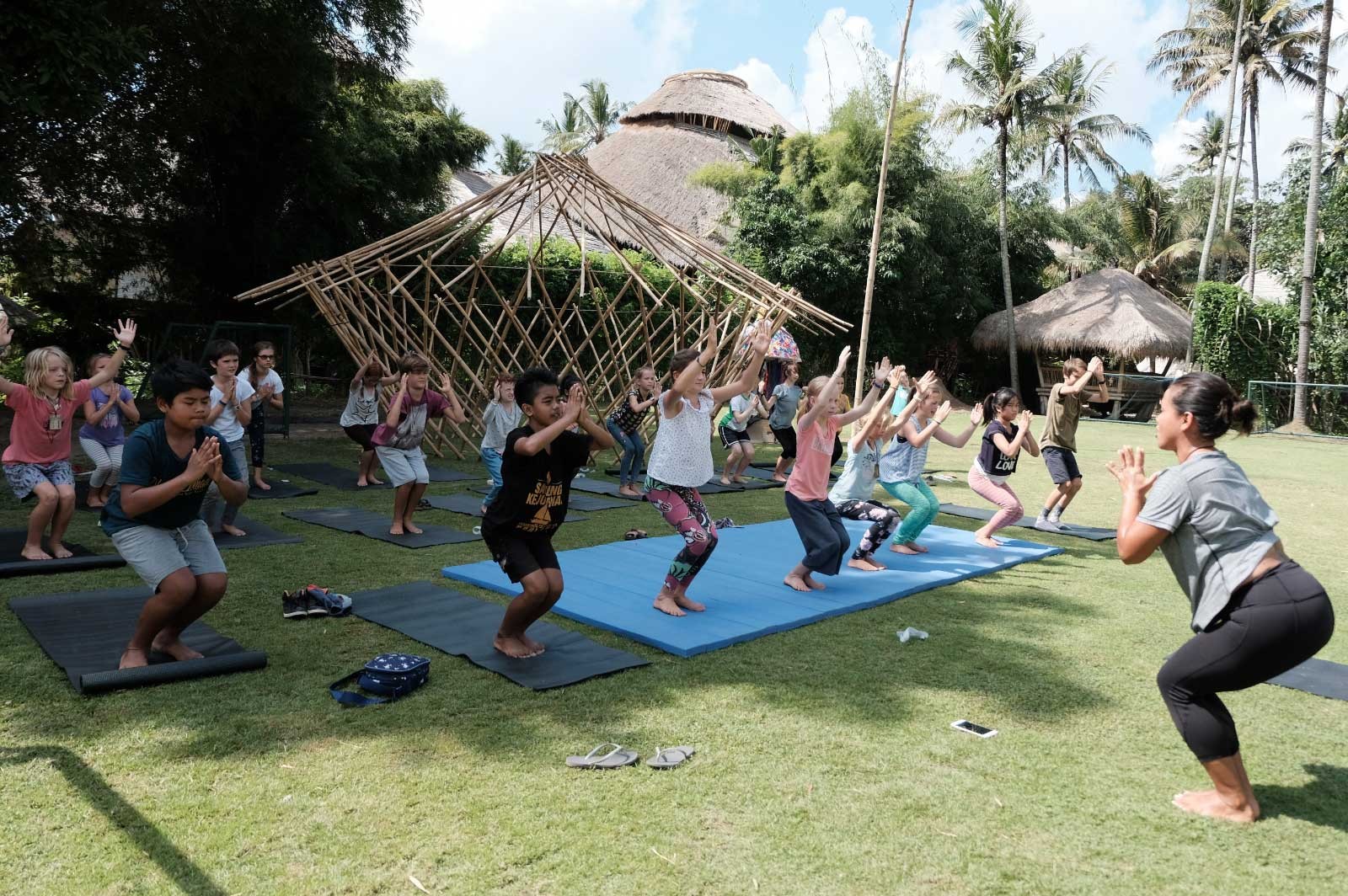 Teacher and students in a yoga class